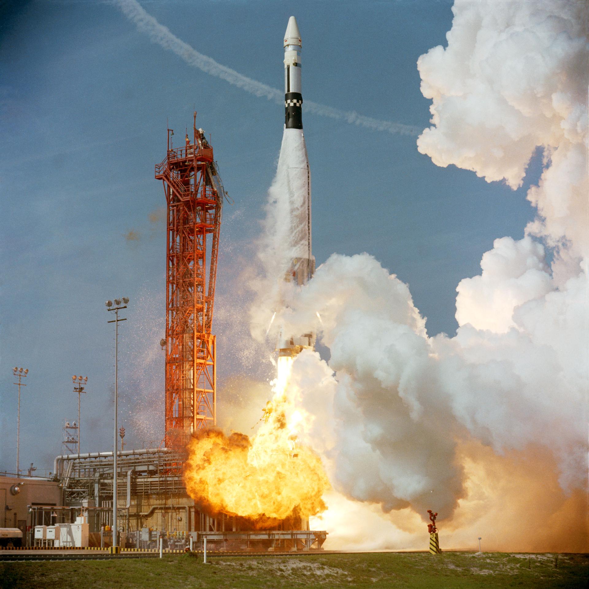Gemini 8 lifting off from Cape Kennedy, March 1966, clearing the launch gantry